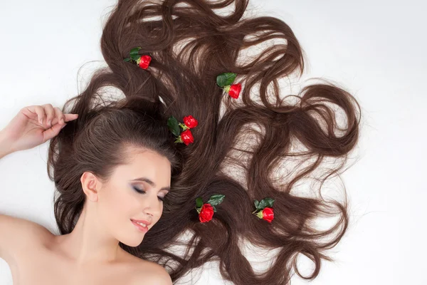 Cheerful healthy girl is showing her hairstyle — Stockfoto