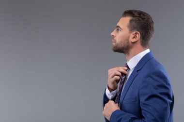 Attractive young man is caring of his image