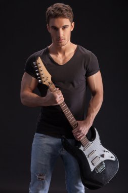 Handsome male musician is ready for performance