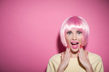 Cute young woman is evincing big shock