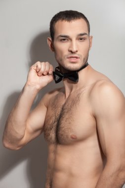 Handsome young macho is evincing his desire