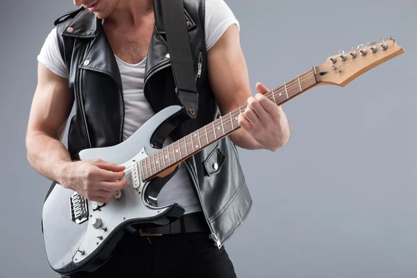 stock image Cheerful young guitarist is making great performance