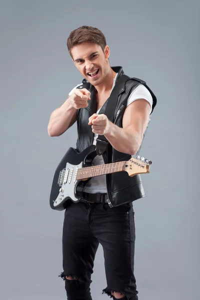 Cheerful young guitarist is ready for his performance — Stockfoto