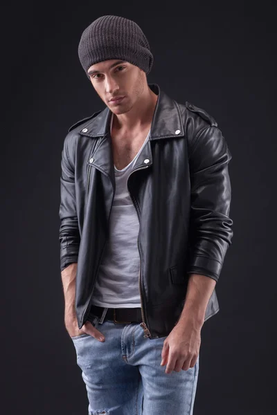 Handsome young musician is preparing for concert