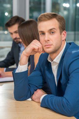Skillful three business partners are working together