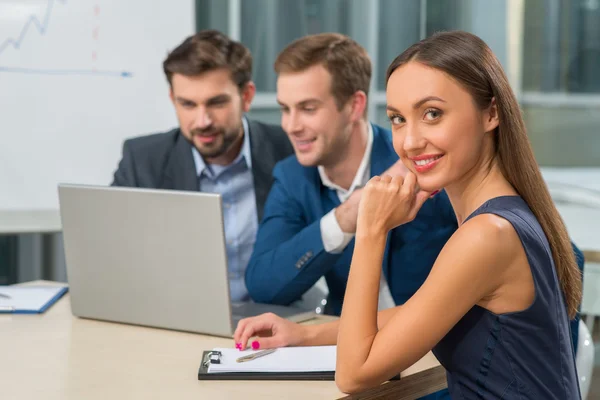 Cheerful young working team on business meeting — Stock Fotó