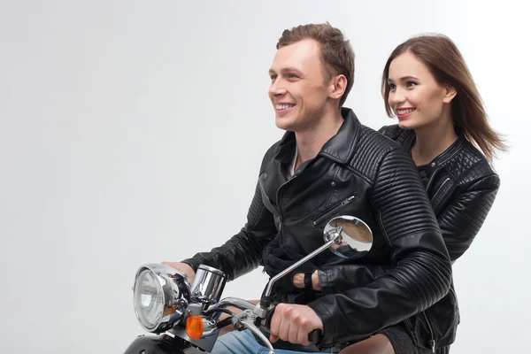 Cheerful boyfriend and girlfriend on motor bike — Stockfoto