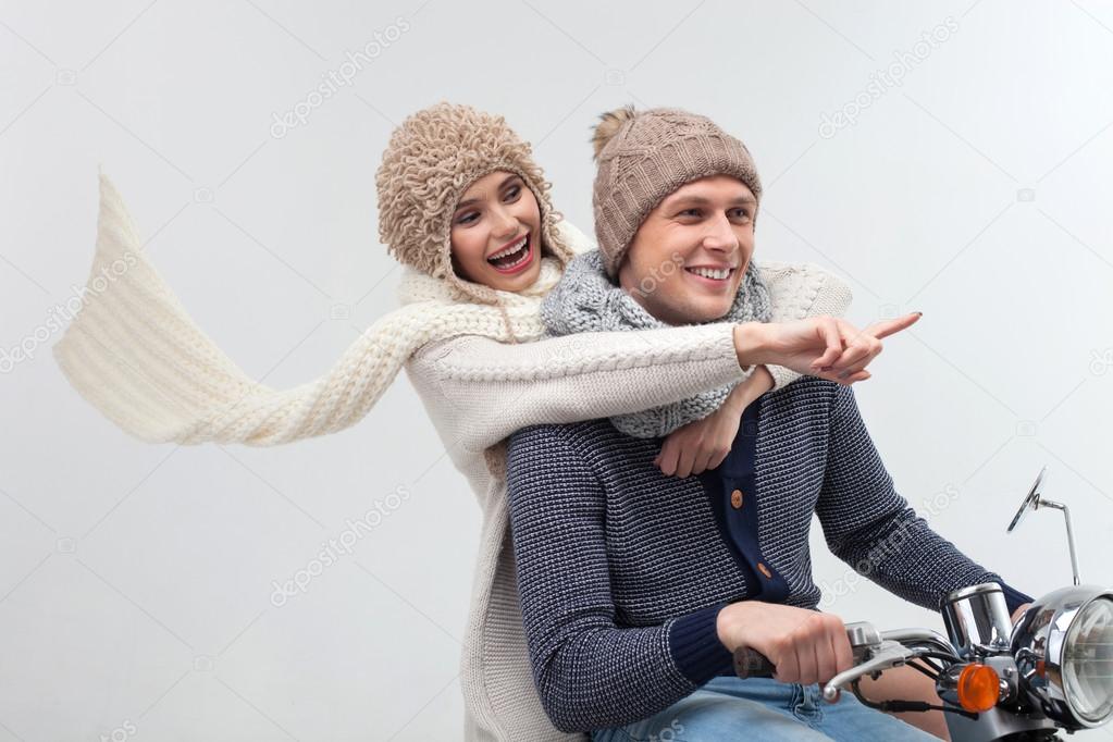Cheerful young loving couple is enjoying trip