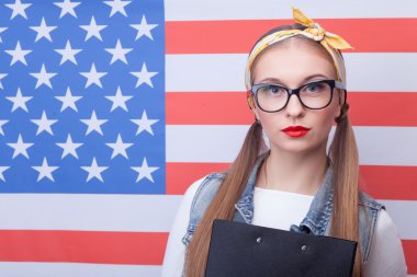 Cheerful American female student with folder of documents