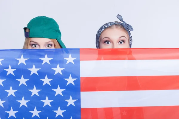 Attractive female American friends are making fun — стокове фото