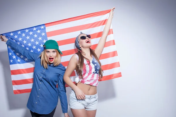 Cheerful young women are expressing their patriotism
