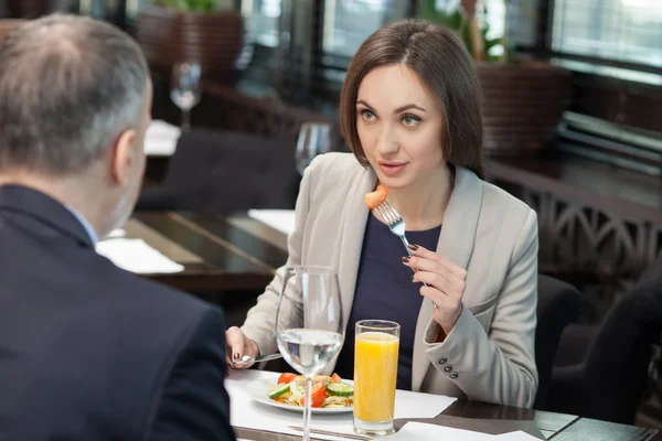 Cheerful colleagues have a meeting in restaurant — 스톡 사진