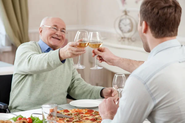 Cheerful family is celebrating with alcohol drink — Φωτογραφία Αρχείου