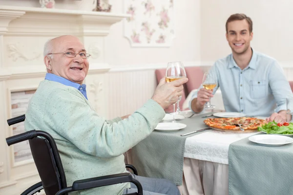 Two men have a family diner in cafe — Φωτογραφία Αρχείου