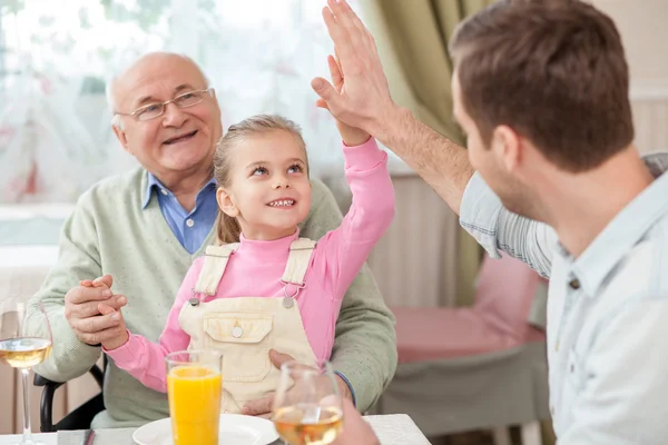 Cute family has a dinner in cafe — Zdjęcie stockowe