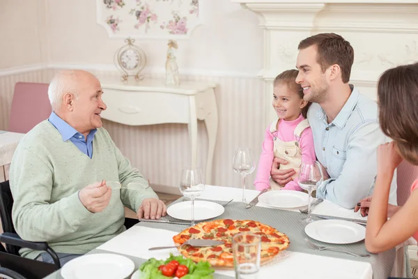 Pretty friendly family is dining in cafe — Zdjęcie stockowe