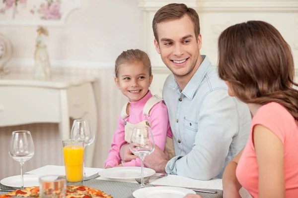 Cheerful married couple and child have a lunch — Stock Photo, Image