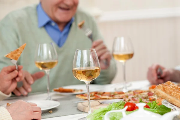 Cheerful mature parents are dining with son — Stock Fotó