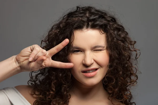 Cheerful young healthy girl is gesturing positively — Zdjęcie stockowe