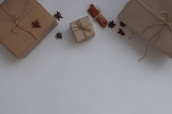 New Years gifts, cinnamon, star anise on a white background with place for text. Top view