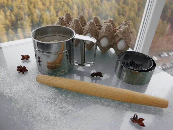 Biscoitos ingredientes e utensílios de cozinha em mesa de vidro na cozinha. Rolo de madeira, peneira com farinha, ovos de galinha, anis estrelado, cortadores de biscoitos — Fotografia de Stock