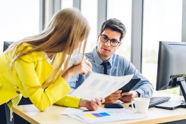 Two professional business meeting and discussing strategy with new startup project.Creative business people planning and brainstorm with desktop computer in modern office.Teamwork concept