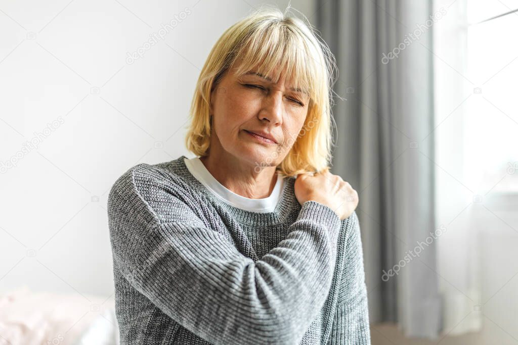 Sick senior adult elderly women touching the neck have shoulder and neck pain.Healthcare and medicine concept