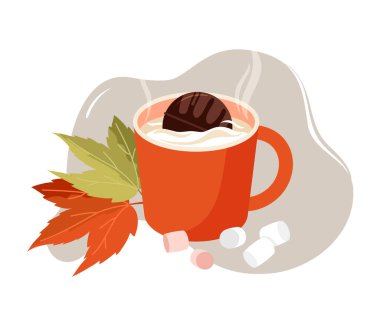 Sonbahar yapraklarıyla çevrili sıcak süt ve kakao bombasıyla dolu bir kupa..