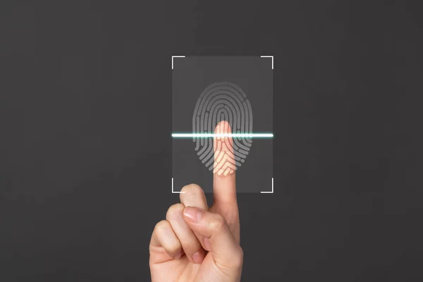 Hands show the fingerprint scanner screen to access personal user online.