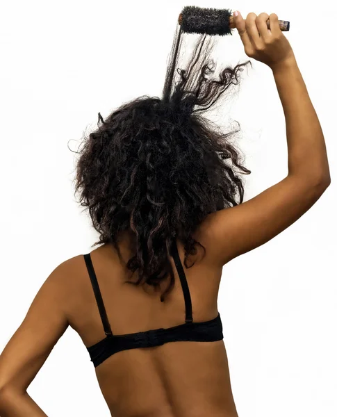 Back of a Female Brushing Wild Dyed Hair — Stock Photo, Image