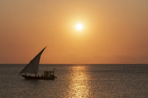 ZANZIBAR, AFRICA - SEPTEMBER 27, 2013: Sailing boat during sunset Royalty Free Stock Photos