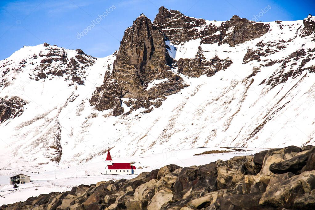 Vik i myrdal, church between snow covered mountains in Iceland 