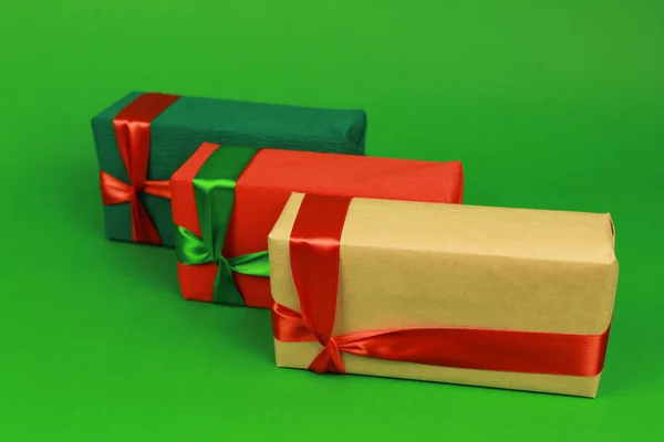 Three Bright Identical Gifts Ribbons — Stock Photo, Image