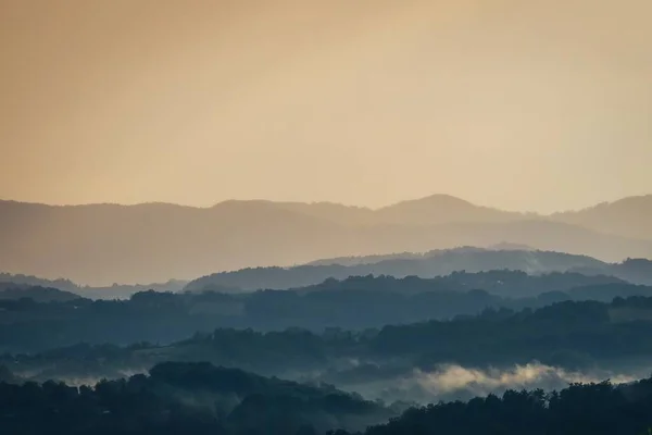 Layers of hills in the morning mist