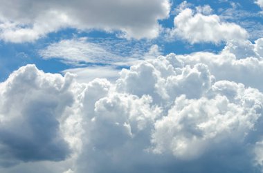 Bright sun rays shining through dense clouds in the sky creating a divine and hopeful atmosphere