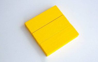 Top view of yellow wooden blocks with customisable space for text