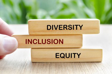 One Team, Leadership and empower text on wooden blocks. Leadership concept