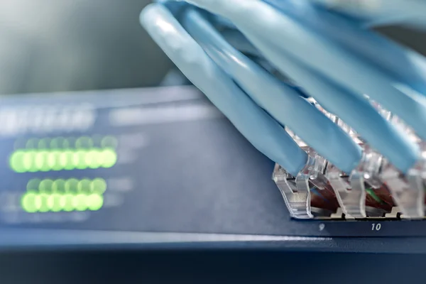 Gigabit switch with cables — Stock Photo, Image