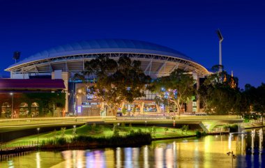 Adelaide Oval and River Torrens Foot Bridge at night. Long exposure effect. clipart