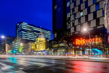 IBIS Hotel Adelaide with taxis at night clipart