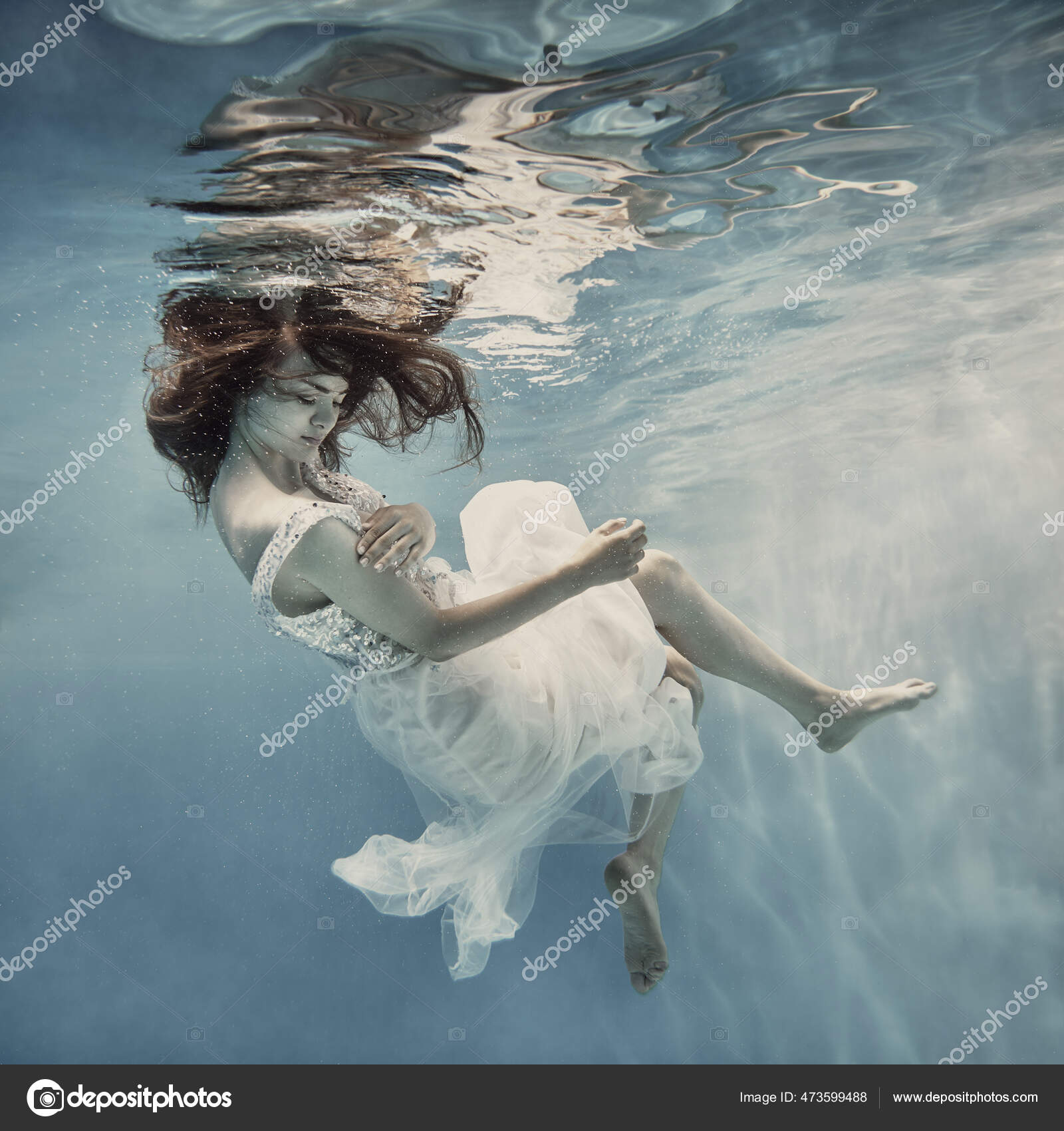 Girl Long Dark Hair White Dress Glitters Floats Underwater Floating ...