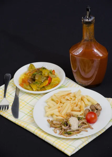 Pasta with pig ears soy salade and hot sauce — Stock Photo, Image