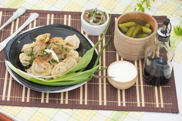 Small pockets of dough filled with minced meat — Stock Photo, Image