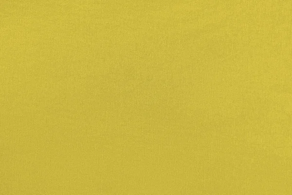 2021 'in ana rengi aydınlatıcı. Dokulu yüzeyi ve kumaşı olan homojen sarı arkaplan.