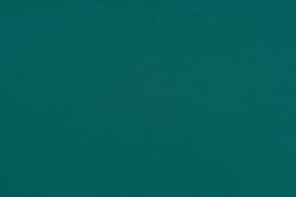 Dokulu bir yüzeyi ve kumaşı olan homojen yeşil arkaplan.