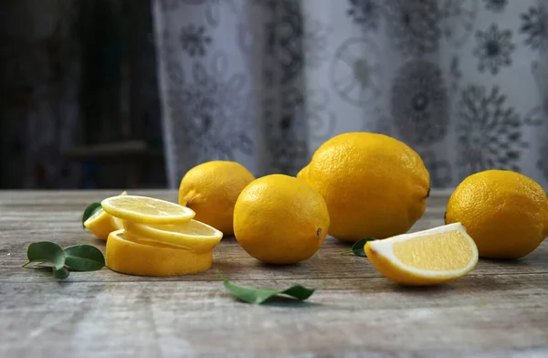 Many Fresh Ripe Lemons Green Leaves Wood Table Closeup — Stock Photo, Image