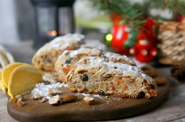 Christmas cake cake sliced. Oranges, nuts. dried fruits