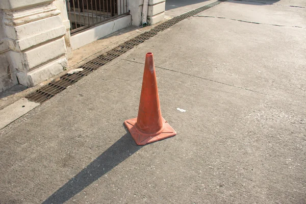 Traffic cone in the road on a sunny day — Stock Photo, Image