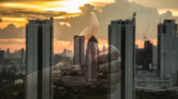 Abstrac blur of business towers before sunset with thumb up. — Stock Photo, Image