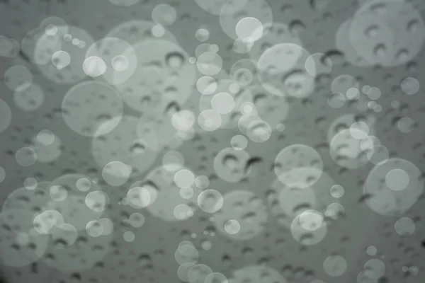 Abstract blur of Water Drops on glass with bokeh, use for Backgr — Stock Photo, Image